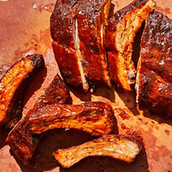 cotso cry ribs on a serving board